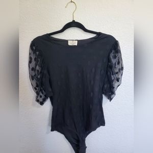 Black polka dot body suit